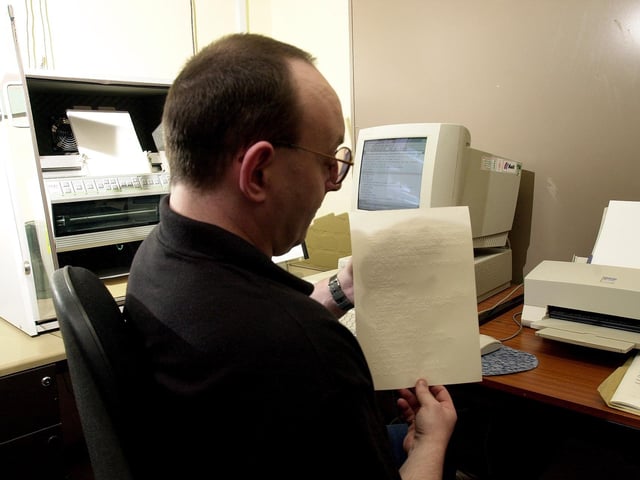 Saughton Community Prisoner Tam, demonstrating the prison library's new facillity for word processing normal text and translating it into Braille at Saughton Prison, Edinburgh; March 5, 2002.