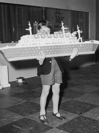 Ian Pemberton, seven, with a Lego model liner that was part of a Lego city built in London's Selfridges in 1962 (Picture: Kent Gavin/Keystone/Hulton Archive/Getty Images)