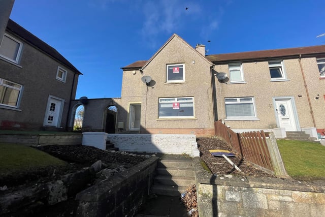 The exterior of the terraced house, which is located in Andrew Avenue in Bathgate. There is a large private corner garden to the rear of the property.