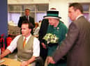 Queen Elizabeth on her visit to the Edinburgh Evening News in 1999 with then picture editor Tony Marsh, left, and then editor John McLellan