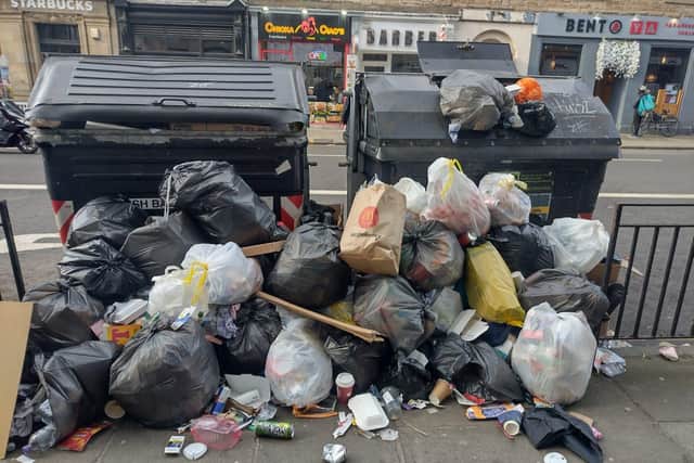 Overflowing bins in Bread Street show the impact of the bin workers' strike.