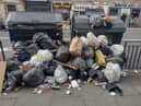 Overflowing bins in Bread Street show the impact of the bin workers' strike.