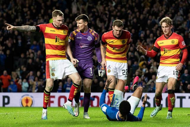 Rangers' Malik Tillman is confronted by Partick Thistle players after scoring in the cup tie between the two sides at Ibrox