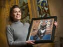 Artist Grace Maran with her portrait of William the Rosslyn Chapel Cat. Photo: Rob McDougall.