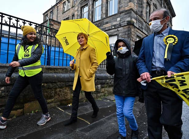 Nicola Sturgeon and candidate Roza Salih (L)  at Annette Street school polling station in Glasgow
