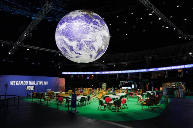 The Earth hangs over an empty Action Zone in the OVO Hydro building during the COP26 summit in Glasgow. Picture: Ian Forsyth
