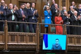 A video grab from footage broadcast by the UK Parliament's Parliamentary Recording Unit (PRU) shows MPs giving a standing ovation to Ukraine's President Volodymyr Zelensky after he speaks to them by live video-link in the House of Commons. Picture: AFP via Getty Images