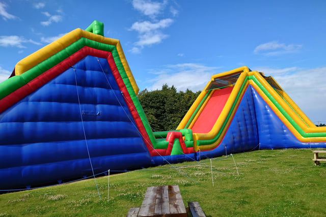 The two large slides at the end of the Tartan Titan challenge.