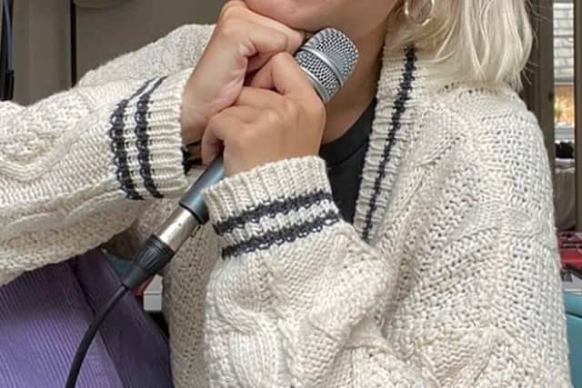 Former Balerno High School pupil Nina Nesbitt proudly poses in her new cardigan, gifted to her by pop pal Taylor Swift.