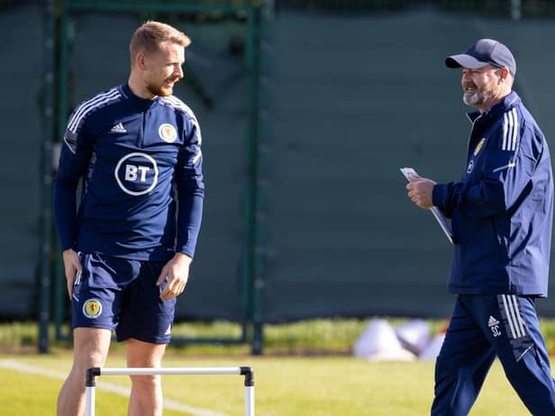 Hearts defender Stephen Kingsley with Scotland coach Steve Clarke at training on Monday.