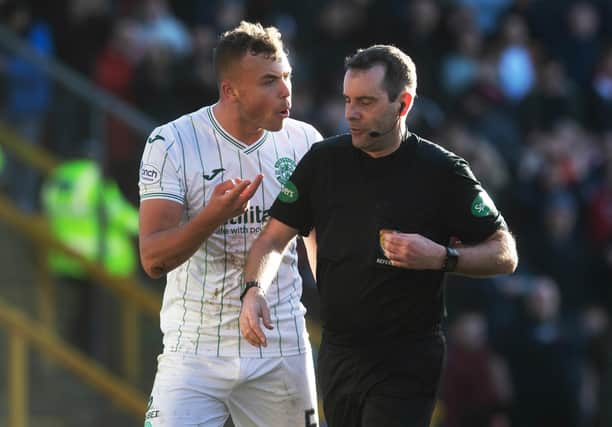 Hibs defender Ryan Porteous argues with referee Alan Muir after his sending-off against Aberdeen