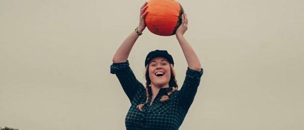 Doncaster artist Rebecca Wright photographed by @david8photography with a pumpkin.