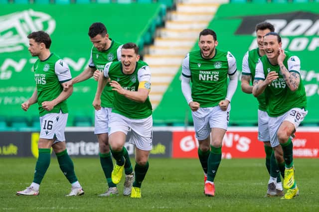 The Hibs players celebrate winning the penalty shoot-out against Motherwell