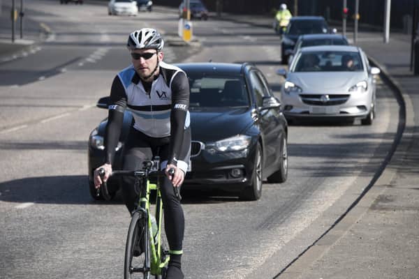 Police Scotland stages regular Close Pass operations to encourage drivers to overtake cyclists safely. Picture: Andrew O'Brien