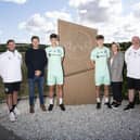 Jacob, left, and Oscar MacIntyre with, left-right: Hibs manager Lee Johnson, father Boyd, mother Stephanie, and Hibs academy chief Steve Kean. Picture: Hibernian FC
