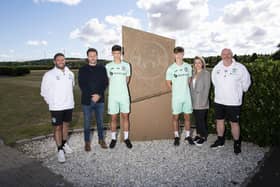 Jacob, left, and Oscar MacIntyre with, left-right: Hibs manager Lee Johnson, father Boyd, mother Stephanie, and Hibs academy chief Steve Kean. Picture: Hibernian FC