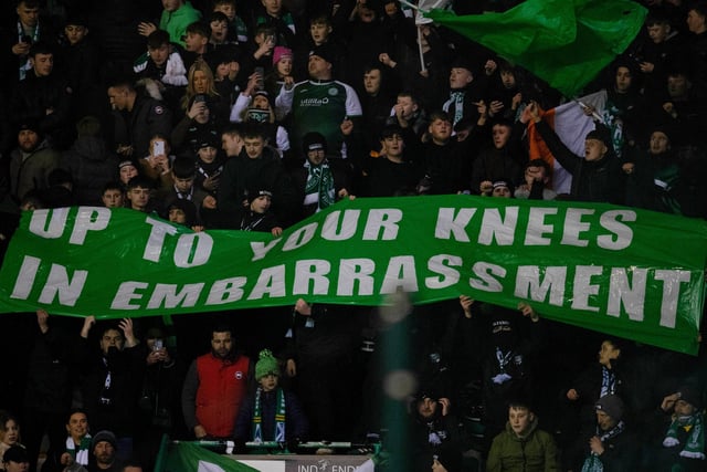Hibs fans with a banner aimed at Rangers fans