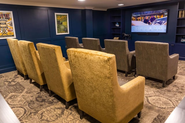 Residents can sit back and relax in front of the big screen.