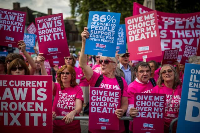 Campaigners in support of assisted dying protest outside the Houses of Parliament in London (Picture: Rob Stothard/Getty Images)