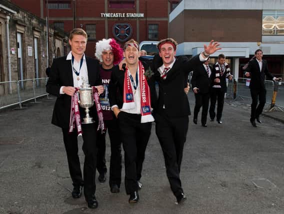 Hearts players including Marius Zaliukas, Rudi Skacel and Danny Grainger celebrate winning the 2012 Scottish Cup.