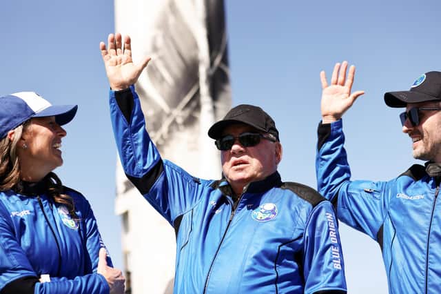 Star Trek actor William Shatner, centre, celebrates after becoming the oldest person ever to go into space (Picture: Mario Tama/Getty Images)