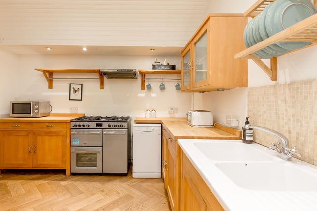 Situated on the lower level is a large and well-equipped dining kitchen area, with wall mounted units and garden access, the space has a cosy country feel