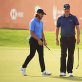 Marc Warren, right, smiles on the 18th green after finishing with a birdie in the Abu Dhabi HSBC Championship at Abu Dhabi Golf Club. Picture: Andrew Redington/Getty Images.