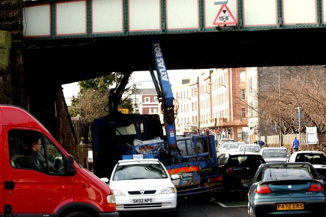 An HGV with a mounted crane got stuck under the rail bridge at the junction of Robertson Avenue and Gorgie Road.