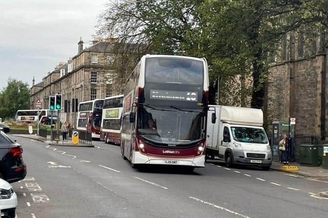 Buses are at the centre of a row over noise in East London Street in Edinburgh's New Town: now the council is to explore options including tarmacking the central carriageway.