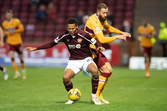 Toby Sibbick goes off injured after colliding with Motherwell's Kevin Van Veen