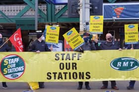 Transport and energy workers from the National Union of Rail, Maritime and Transport Workers (RMT) inside Waverley Station in Edinburgh ahead of a march to the First Minister's office protesting at what they claim is the 'betrayal of Cop26 promises.'