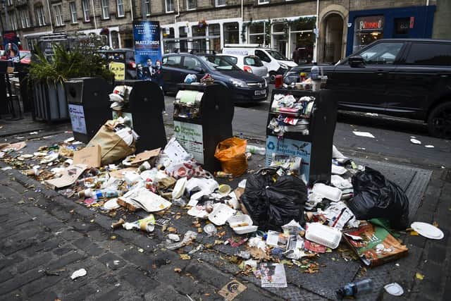 Piles of rubbish can be seen around bins throughout the city centre