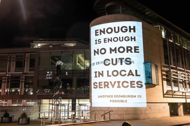 The anti-cuts message was taken to the council offices at Waverley Court