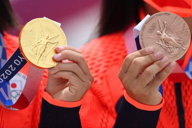 Momiji Nishiya, winner of the gold medal, and Funa Nakayama, winner of the bronze medal, of Team Japan pose with their medals during the Women's Street Final medal ceremony on day three of the Tokyo 2020 Olympic Games at Ariake Urban Sports Park on July 26, 2021 in Tokyo, Japan. (Photo by Patrick Smith/Getty Images)