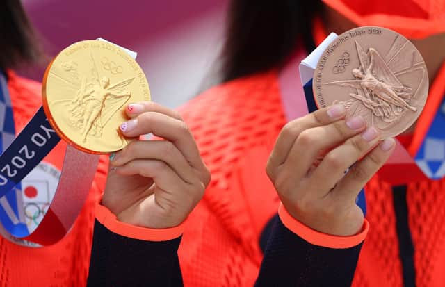 Momiji Nishiya, winner of the gold medal, and Funa Nakayama, winner of the bronze medal, of Team Japan pose with their medals during the Women's Street Final medal ceremony on day three of the Tokyo 2020 Olympic Games at Ariake Urban Sports Park on July 26, 2021 in Tokyo, Japan. (Photo by Patrick Smith/Getty Images)