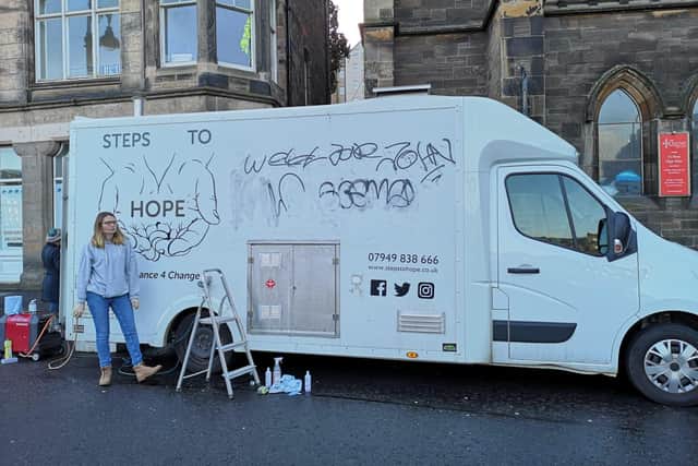 The Steps to Hope team cleaning the van, which is out serving food to Edinburgh's homeless.