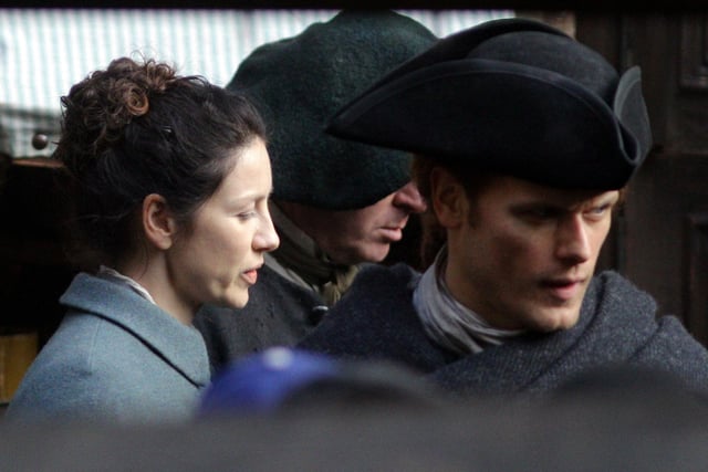 Outlander stars Sam Heughan and Caitriona Balfe are pictured filming scenes on Tweeddale Court off the Royal Mile in Edinburgh, where characters Claire and Fergus were reunited.