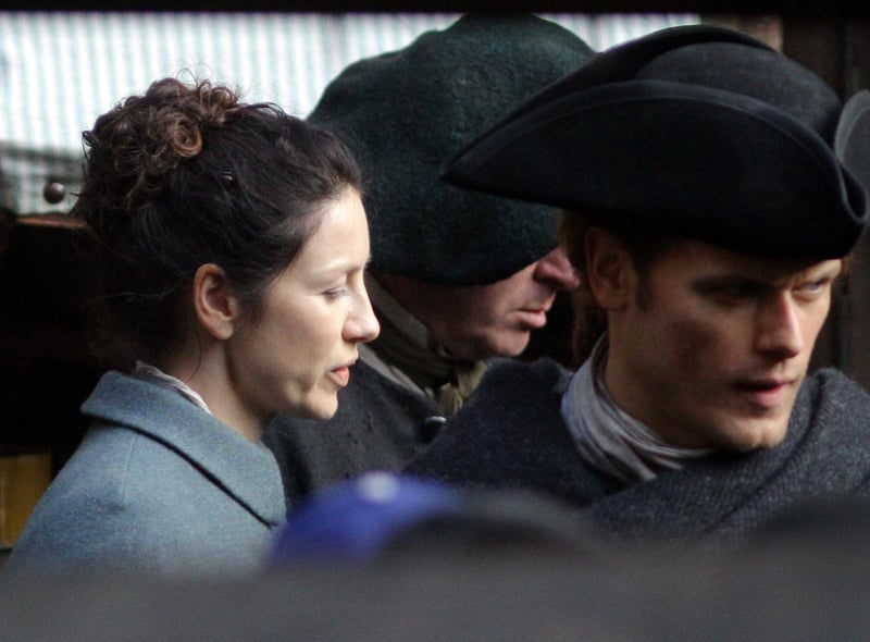 Outlander stars Sam Heughan and Caitriona Balfe are pictured filming scenes on Tweeddale Court off the Royal Mile in Edinburgh, where characters Claire and Fergus were reunited.