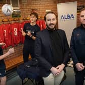 Richard Jacobs  of ALBA with Edinburgh University Association Football Club manager, Sean McAuley, and players immediately before the Albion Rovers match at Peffermill on 9 December. Photo by Stewart Atwood.
