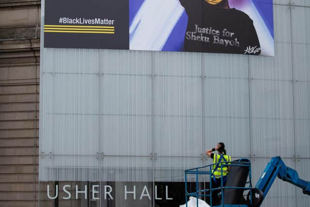 A giant mural inspired by Sheku Bayoh on the side of Edinburgh’s Usher Hall.