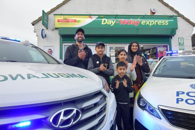 Emergency services gather to thank Jawad and Asiyah Javed owners of the Day Today Express for all they have done for the community.