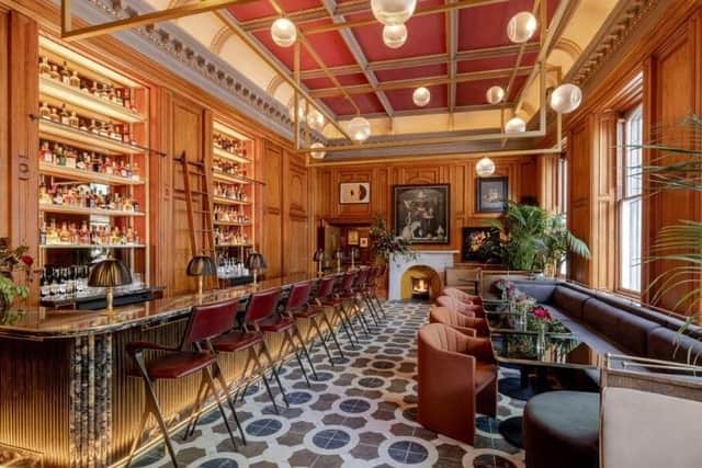 Original features make for a grand bar space on the lobby level floor. Pic: Contributed