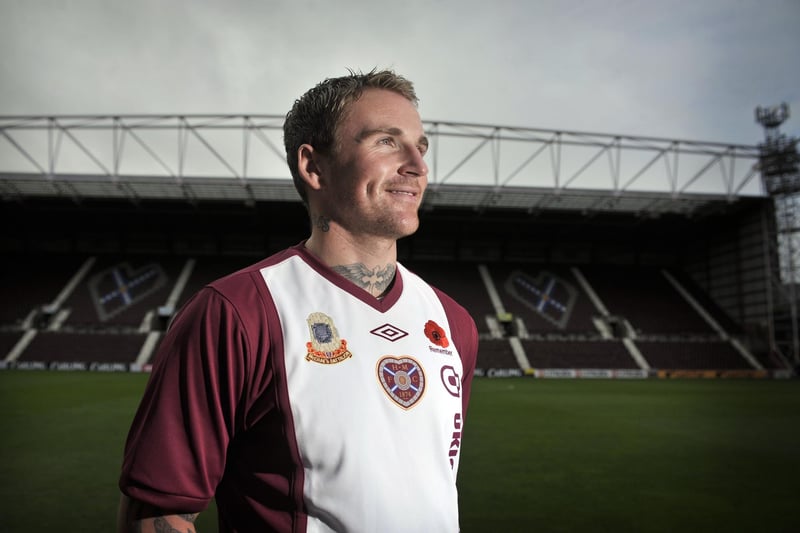 This unusual choice for Hearts home kit, with the 'Ajax-style' kit first used by the Jambos in 1972. Here, Ryan Stevenson is pictured wearing the top especially for Rememberance Sunday 2010, complete with Poppy. Photo by Jayne Emsley.