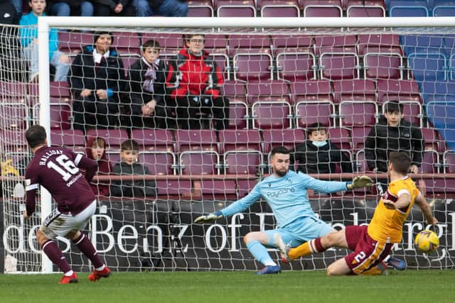 Andy Halliday slots the ball past Liam Kelly to put Hearts 1-0 up against Motherwell. Picture: SNS