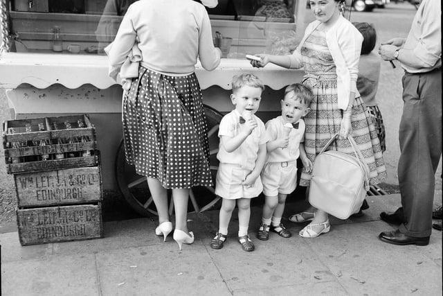 Youngsters Gordon Macpherson and Neill MacPherson eating ice cream at an ice cream van in Princes Street in August 1961.