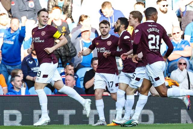 Hearts players celebrate Lawrence Shankland putting the away side in front at Ibrox. Picture: SNS