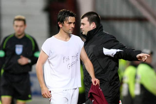 Paul Hartley displayed a message to George Burley after the win over Dunfermline, the day the manager was sacked. Picture: SNS