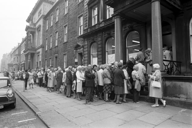 Edinburgh pensioners queue outside the Lothian Region Transport office in Queen Street for up to two hours to apply for special OAP bus passes in August 1983 after the Tory-led regional council ended free travel for the elderly and said OAPs would have to pay 10p a journey for off-peak travel unless they bought a £30 pass.