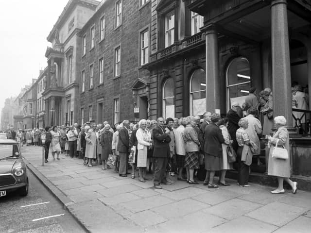 Edinburgh pensioners queue outside the Lothian Region Transport office in Queen Street for up to two hours to apply for special OAP bus passes in August 1983 after the Tory-led regional council ended free travel for the elderly and said OAPs would have to pay 10p a journey for off-peak travel unless they bought a £30 pass.
