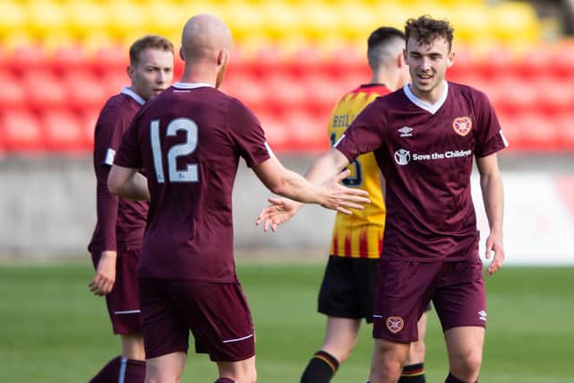 GLASGOW, SCOTLAND - OCTOBER 02: Hearts' Andrew Irving (right) celebrates with teammates after he curls home to make it 2-0 during a friendly match between Partick Thistle and Hearts at the Energy Check Stadium at Firhill, on October 02, 2020, in Glasgow, Scotland. (Photo by Mark Scates / SNS Group)
